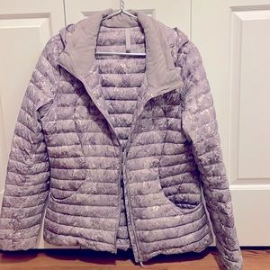 Lulu Lemon packable jacket in lavender print - hooded.  Size 10 - comes with bag